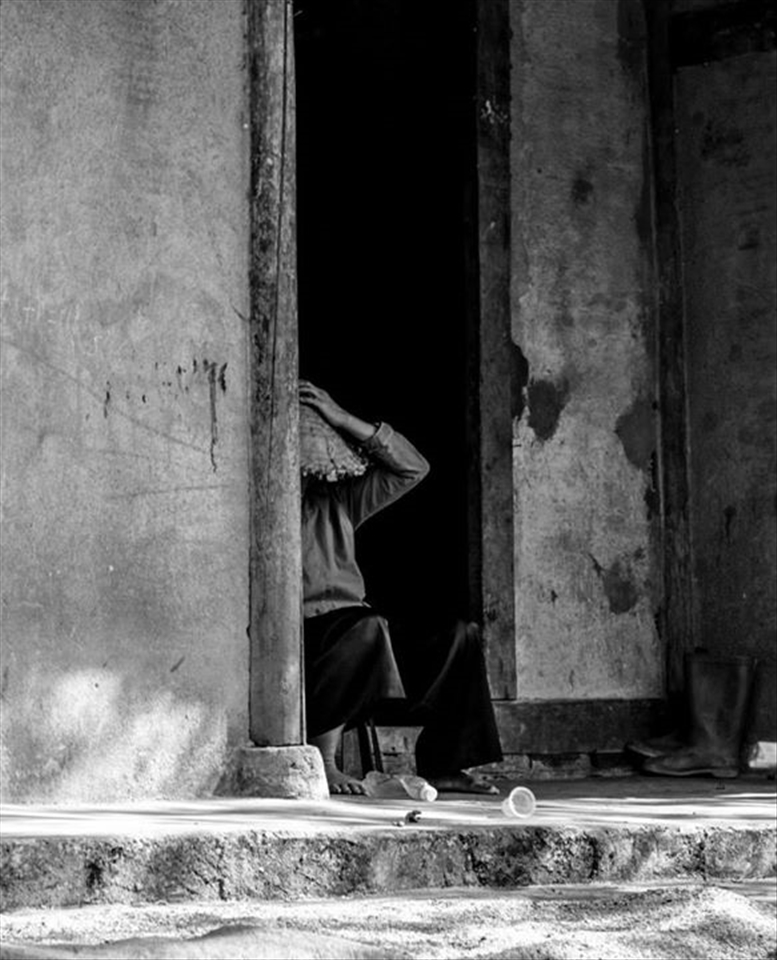 Men resting during lunch break, North Vietnam