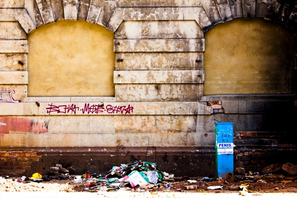 Human settlement in Johannesburg dates back 25 000 years and the buildings are centuries old. This is a deserted building in the middle of the hustling city, but light-hearted beauty can be found in the contrast of the newfound advertisements placed near a building that is so historic in stature. © Robynne Peatfield 2012