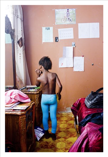 In her room. Siya was adopted after her mom died form HIV.