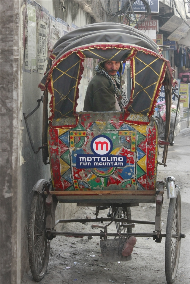 Rickshaws abound in Kathmandu.  They fight for space on overcrowded roads with motorcycles and tuk-tuks, a three wheeled vehicle.
