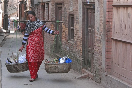 In the ancient city of Bhaktapur, a woman makes her living collecting garbage.