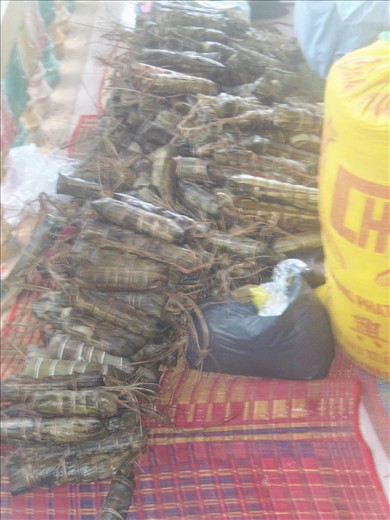 These sticky rice logs are like our fruitcakes - everyone gives them out.