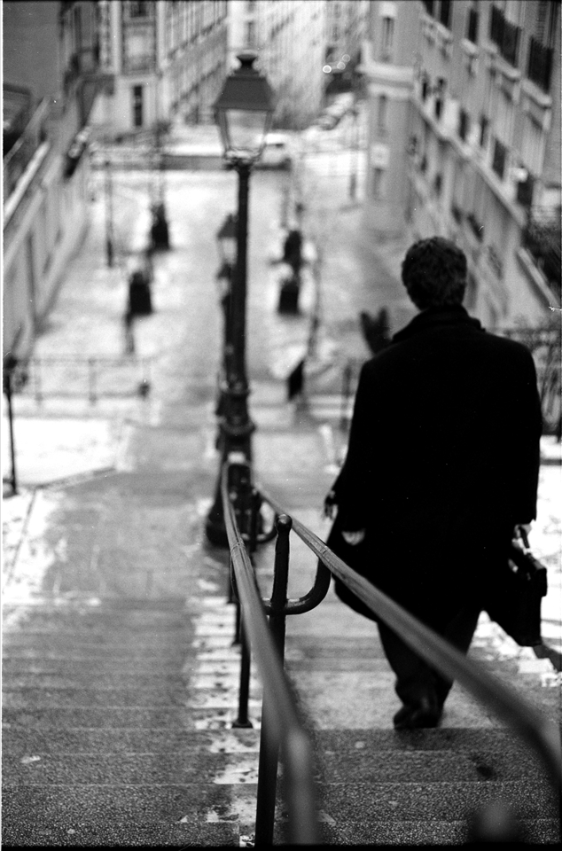 A man makes his way through his city. 