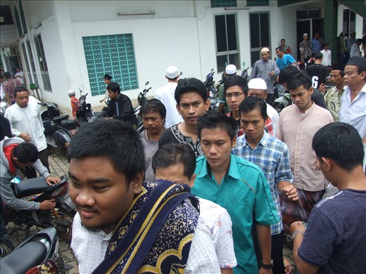 The praying time is finish. Mosque still crowded and people get back to work.