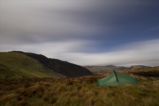 The first of 3 nights hiking in Snowdonia, Wales. The weather was far from ideal with gale force winds, persistent rain and low cloud, I knew right away that the trip was going to be a challenge.

I took this shot to give a feeling to what the weather was like. Wind is invisible, apart from when you have fast moving clouds overhead and the right conditions for a long exposure, you can also see the deformed look of my tent due to the force.