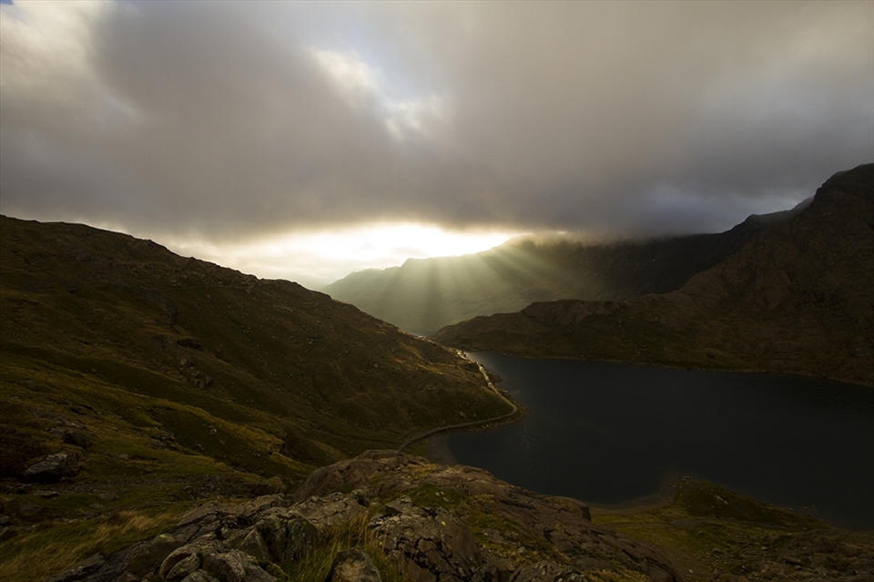 The money shot! After 3 days and nights of challenging conditions, I finally managed to witness the sun breaking through the 

clouds over the mountains of Snowdonia. It was worth every minute of discomfort.