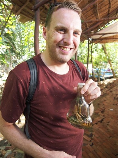 Russ with some 'happy water': rice wine infused with a cobra & some other kind of snake.