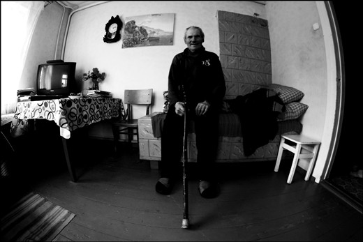 Old man named Antanas in his home in traditional Lithuanian village.