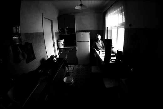 Old woman is having lunch.