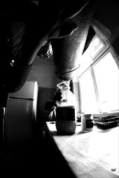 Old woman's daughter is pouring the milk in plastic bottle.: by rutatulis, Views[227]