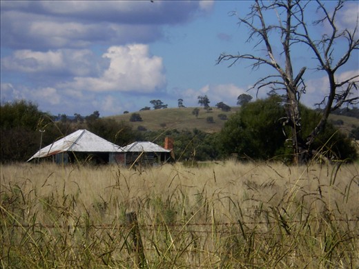 A run down homestead symbolizes the decline of rural living.