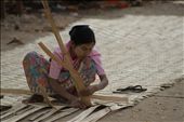A young woman weaves bamboo into walls for her house.: by ryan_elissa, Views[468]