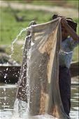 Today is laundry day for this Burmese woman who washes her family’s clothing along the banks of the Irrawaddy River.: by ryan_elissa, Views[328]