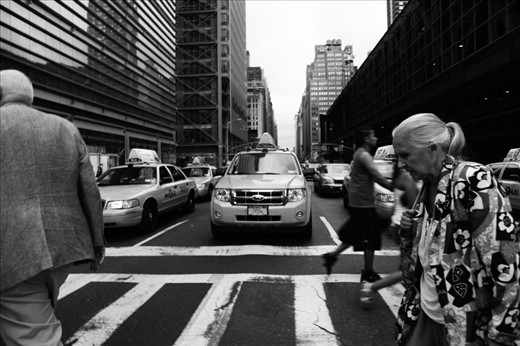 New York - The Daily Grind
Part of living in New York is catching Taxi's or walking several blocks to get to your destination. This lady, old but strong, continues to live the New York way of life! 