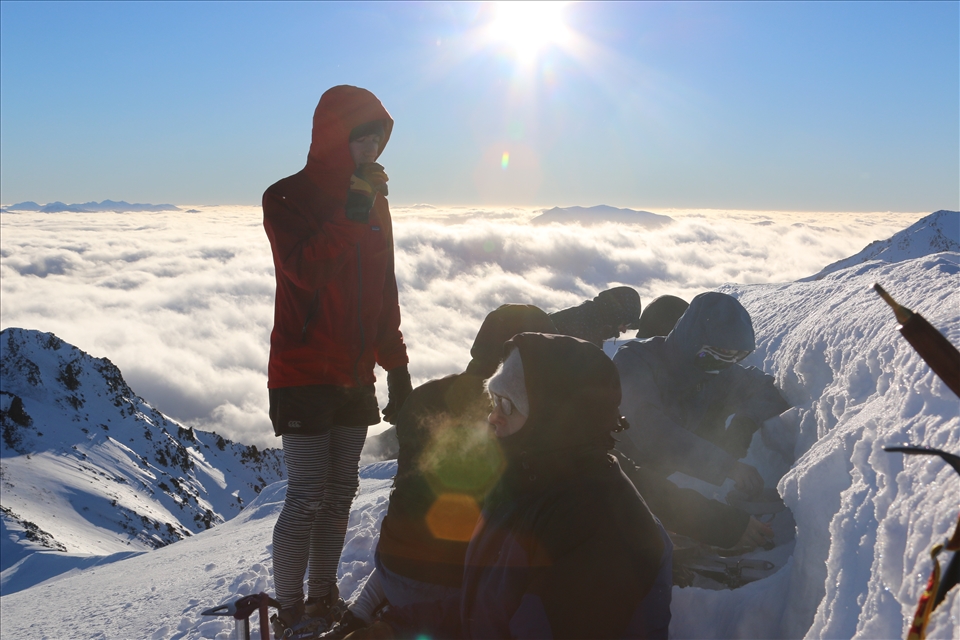 the boys sharing bacon and eggs on the summit, solstice celebrations