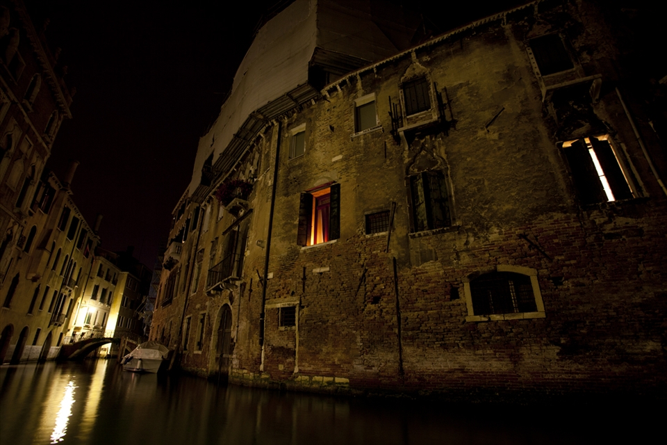 I found this place round the corner from the Rialto bridge. It was a welcome relief from the tourists around. I like the hint of people inside the buildings, with glow from the open window.