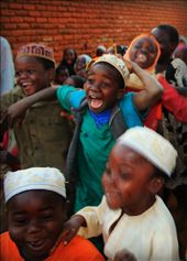 After the children finished at Mosque they saw us passing by. Before we knew it, hundreds were chasing after us. I caught this young boy in the moment of excitement. : by sabahsjourney, Views[830]
