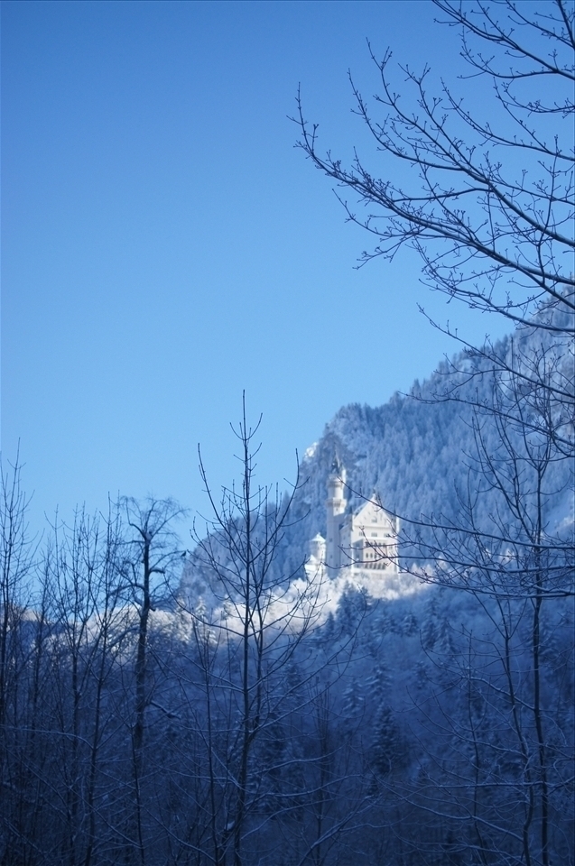 Neuschwanstein Castle more magical when surrounded my snowy mountains and sun