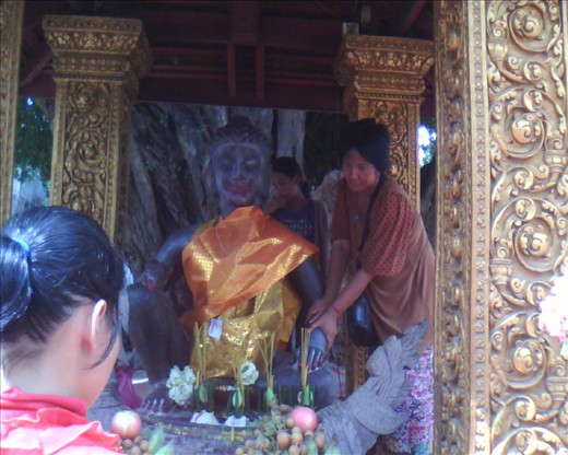 The Buddha statue was then caressed and massaged by the woman inside.