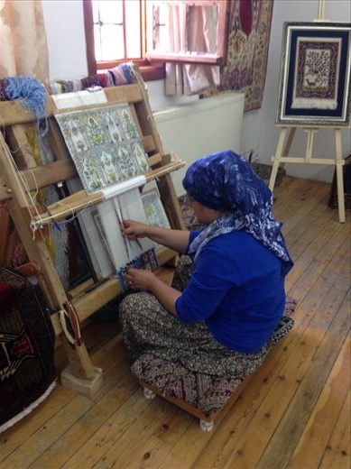 We then toured a gov't run workshop to demonstrate how silk, hand tied rugs are made. It takes roughly 4 months to make one. Starting from the raw silk, of course.