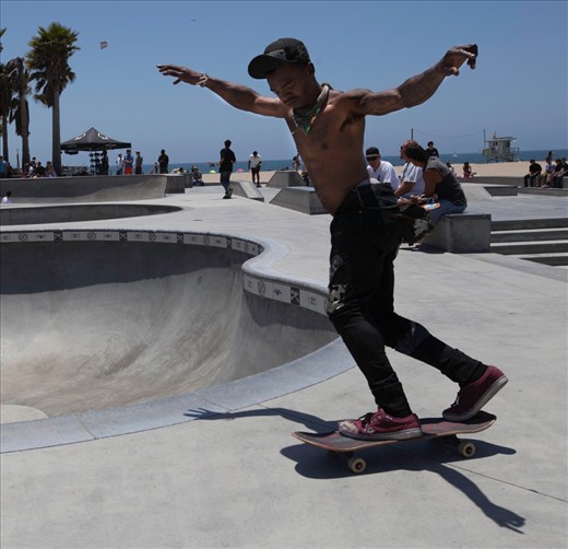 A skater recovers his balance while sliding out. Venice Beach, Calafornia. For anyone whose ever skated or owned a car for that matter, being able to go where you want to go give you such an amazing sense of freedom