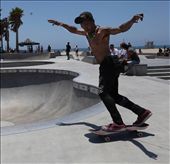 A skater recovers his balance while sliding out. Venice Beach, Calafornia. For anyone whose ever skated or owned a car for that matter, being able to go where you want to go give you such an amazing sense of freedom: by saint33d, Views[547]
