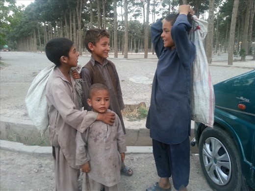 ُStreet working children asking about their daily income,