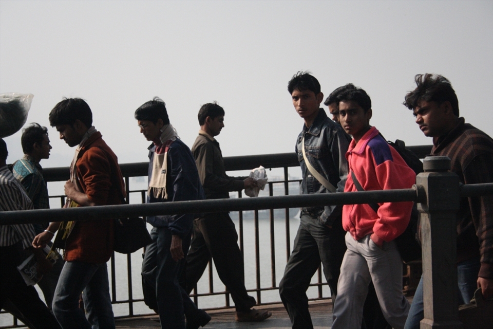 Youths are going to work at 8' o clock crossing the Ganga river in Kolkatta, India.
