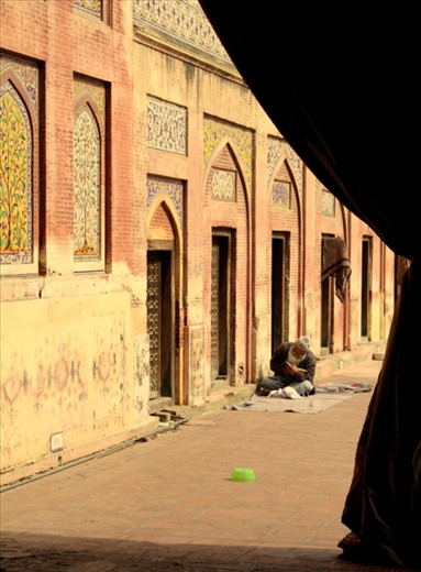 A man reads the Quran before the call to prayer