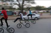 Kessy Ismail a.k.a Kando Master, Yassin Majid a.k.a Yasweezy Bike and Mohamed Hussein a.k.a Mo Bike showing off their agility.  The bus stand has become their play area. It is a well-known fact that no bus will use the Biker Boy’s lane after 1600hrs. Territories have been marked.: by salimally, Views[955]