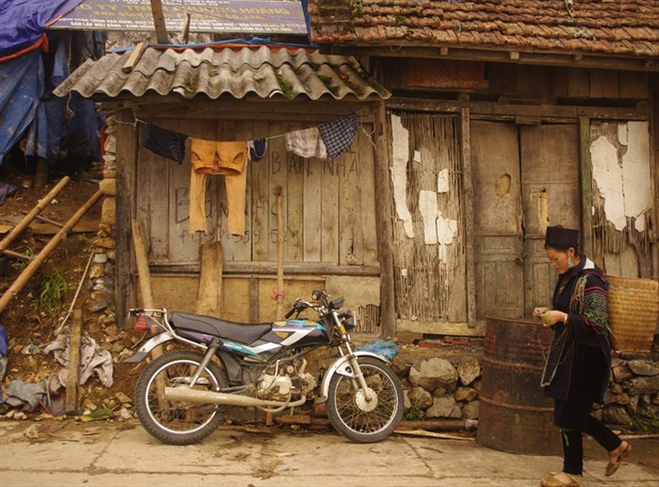 A typical house for a Vietnamese workman, and their family Vehicle. 