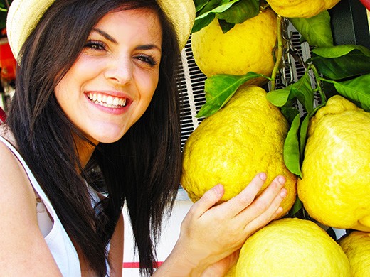 Italian girl at Lemoncello stand on the island of Capri