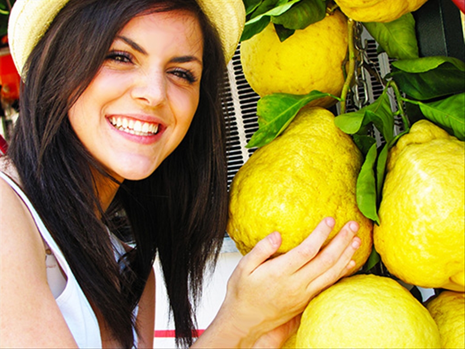 Italian girl at Lemoncello stand on the island of Capri