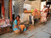 These two women earn money selling the likeness of deities and painted coconuts. Many Hindu worshipers buy these goods as religious offerings at Birla Mandir, a white marble temple further up the hill. : by samanthat, Views[575]