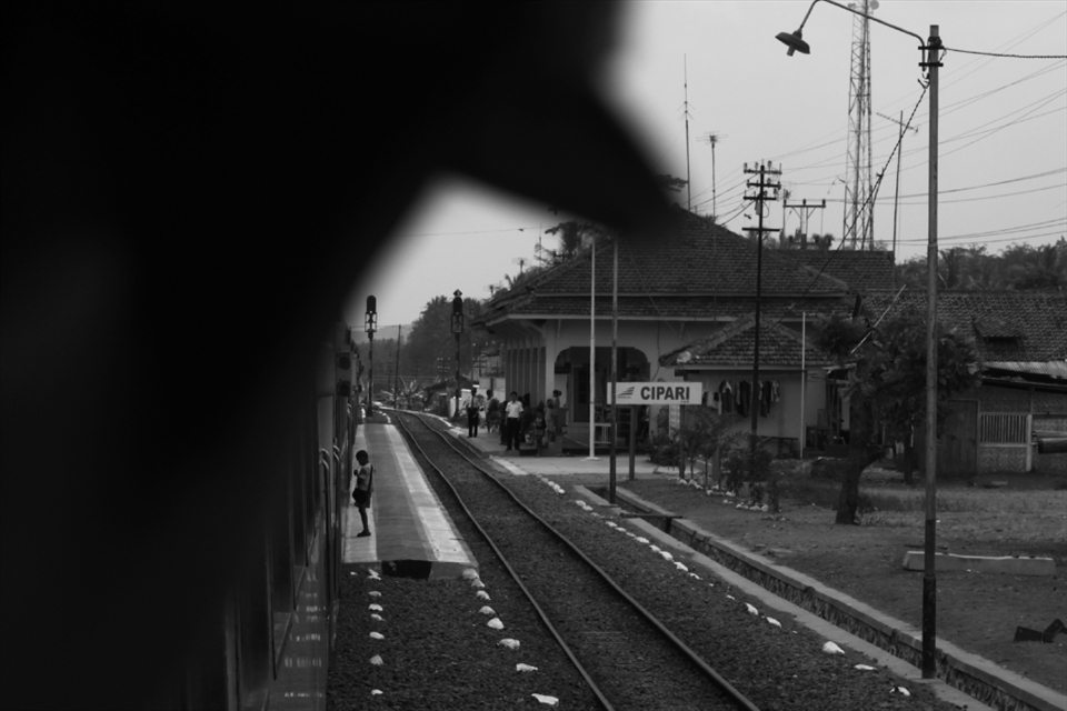 Photo #5 - THE LIBERATION

Even after the train started, the Ticket Inspector looked on to make sure the kid didn’t get on the train again. He shouldn’t have bothered.  Right at that moment, the long unlit one was already finding light. 
