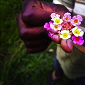 My host brother welcoming me to the family with lantana flowers!: by samibeera, Views[218]