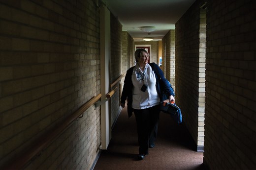 Natalie Cook is a community nurse in Newport, South Wales. Seen here walking through a care home, 