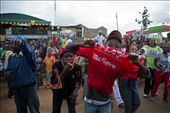 A young Kenyan boy shows his support for the National Alliance Party. It's leader, Uhuru Kenyatta, has just been elected president of Kenya. Other local Kenyans are also celebrating behind him.: by samjwrigley, Views[767]