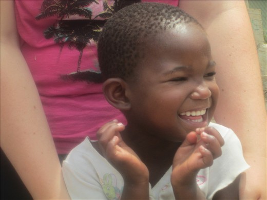 Enchanting smile of a girl who has lived such a tough life.