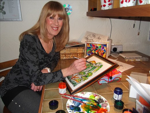I love painting. Here I am working on one of my glass paintings ready for next year's painting holidays. 