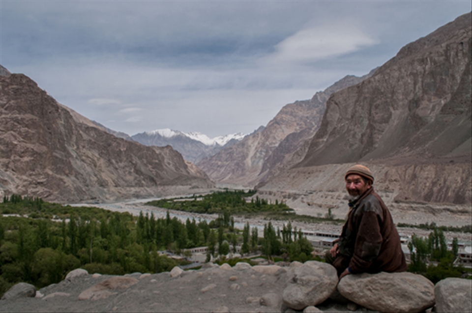 The Nubra Valley is a far-out high altitude desert nestled between the Himalayan and Karakoram ranges. Most of Nubra is inhabited by Buddhist Ladakhis who speak Ladakhi; but on the western end along the Shyok River, in Changmar, Bokdang and Turtuk, people are Balti – they speak Balti and are Shia and Nurbakshia Muslims by faith. Once upon a time Turtuk, now the last village on the Indian side, was a prosperous little settlement on the Caravan Route from Leh to Baltistan. The ancient trail was broken during India-Pakistan partition and Turtuk found itself stranded on the LOC (seen in the distance). Men lost their occupation and the pressure of population upon scarce resources became oppressive.