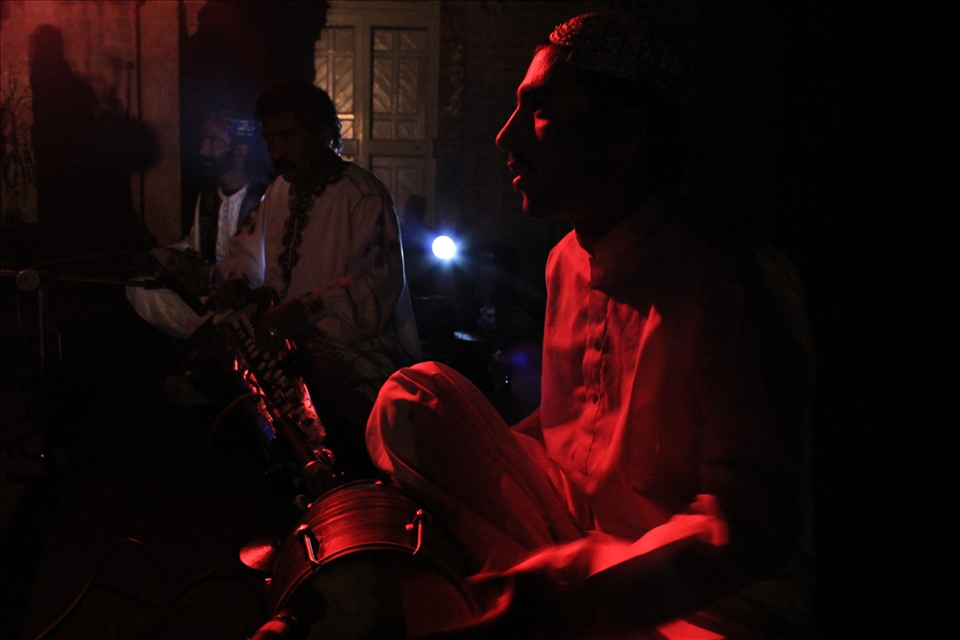 The Balochi folk musicians playing traditional musical instruments during the performance 