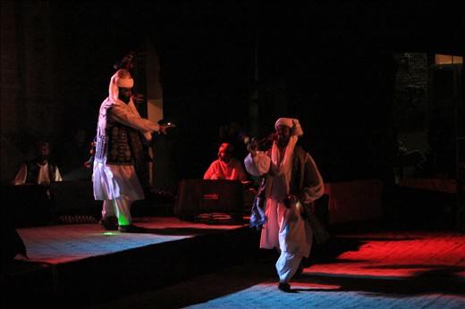 A captivating moment during the dance performance where the two performers dance on difference levels of stage showing off their energy, skill and command on the art of Atan (Balochi folk dance)