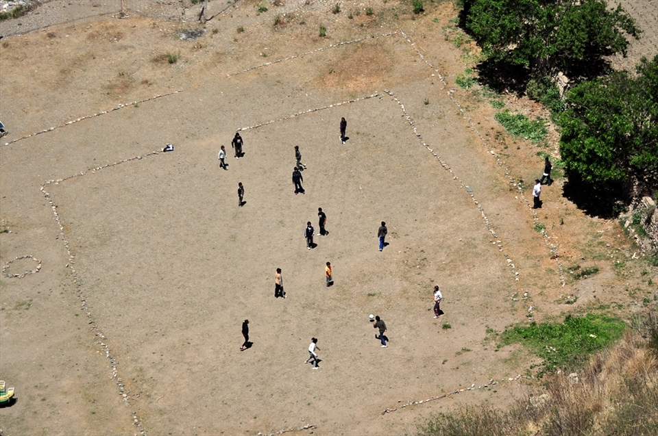 A makeshift soccer field offers playful space at recess to the kids who attend the school from different parts of the mountain.