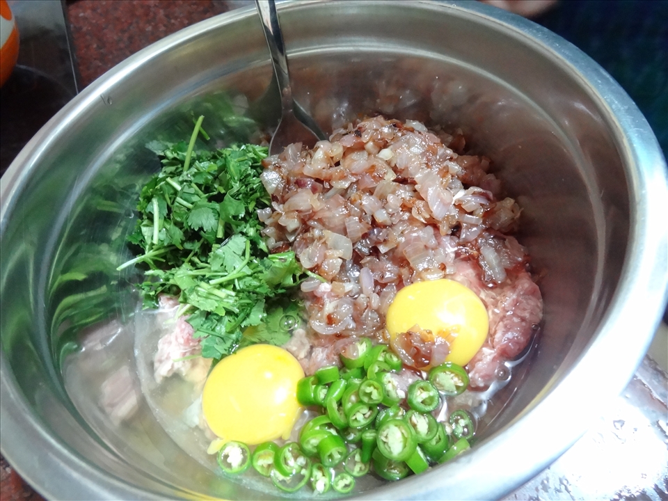 Mixing the ingredients for the keema balls. This is best done with the hand. 