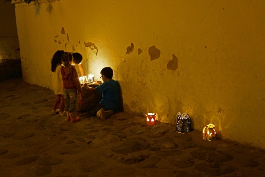 Children lighting candles for the Festival of Light in Villa de Leyva
