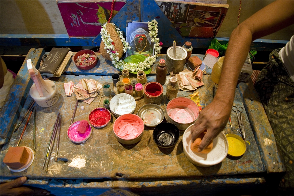 This is an attempt to show the old style drama performance in rural India which are on the brink of extinction thanks to the satellite TV’s.
On the night there was a procession of Lord Krishna and a drama performed in my native village. The drama is called “Draupadi Vastraharan” an important part from the great epic Mahabharata. All the performers were from the village itself with very little or no acting experience, they worked in the farms during the day and practised during the night for more than a month. 
The various colours used by the make-up artist. None of them are tested face paints but just few chemicals mixed to get desired colours and the glue used to fix flat tyres used to paste the moustache and beard.
