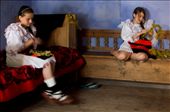 The girls must come back home with the flowers they picked up in the morning and braid crowns which they will proudly wear during the day as a symbol of purity and beauty. Here Patri is still braiding her crown, while the other two girls have already finished theirs and they are joyfully chatting about the boys they are about to meet. I couldn’t help but noticing their innocent enthusiasm and impatience. They are inside a typical house from Maramures owned by Patri’s uncle, who retired and went to a Monastery. Now the girls come here to play and act as if it is their own.: by sanziene, Views[1236]