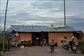 A boy plays on a bicycle outside his temporary home. Migrant workers from Shan State in Burma, this family builds makeshift housing on the construction sites in which they work. (Lamphun, Thailand): by sara_callow, Views[358]