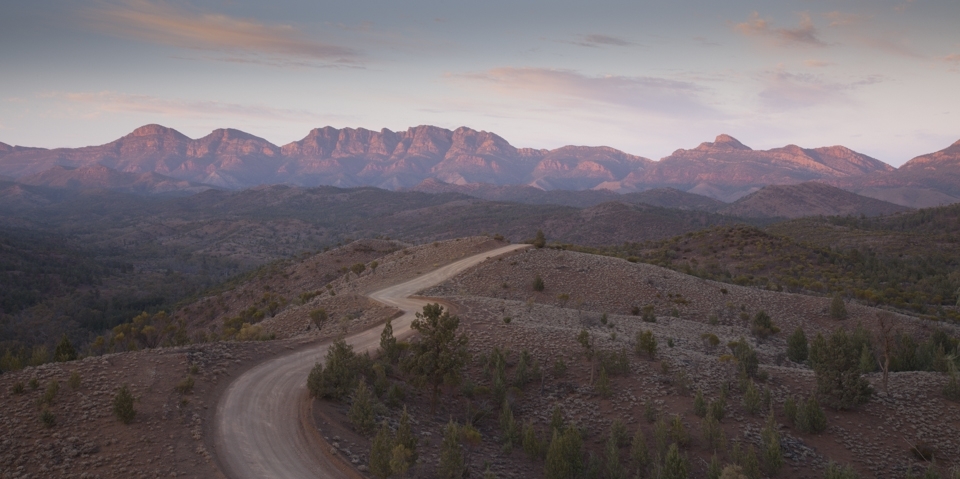 Sunrise at Razor Back lookout.  The name sounds harsh, but the beauty of the range which cannot be understated, softens it.  The meandering road leading to the distant mountain range makes you feel connected to it.  The vast landscape, however, makes you realise how isolated the area can be.  It's an interesting juxtaposition of feelings when you're standing there, at dawn, admiring the beauty, but feeling very small and isolated.  A kangaroo jumped across the road when we were there.  Just one, oblivious or uncaring of our presence.
